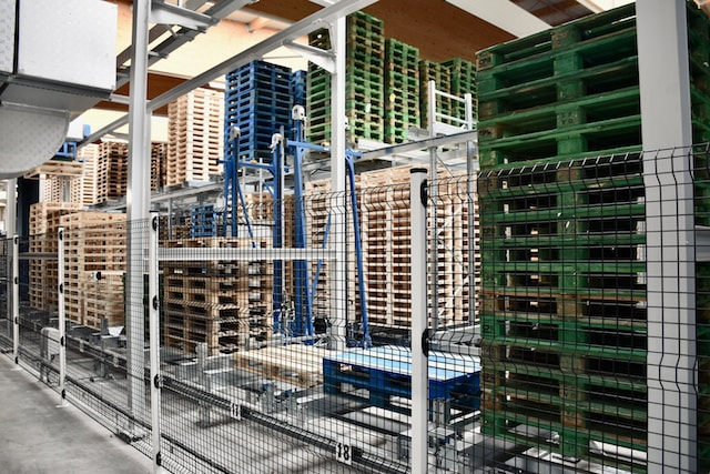 A warehouse with pallets stacked in rows.